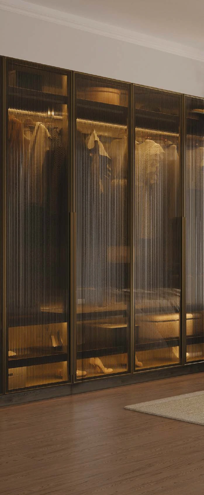 Vitro Brushed Brass wardrobe doors with fluted glass and illuminated interiors